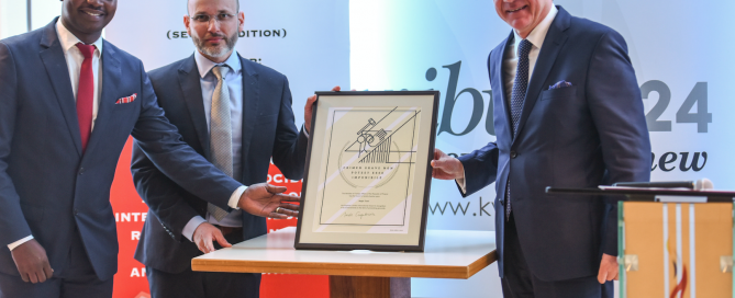 Dr James Smith (centre) and Freddy Mutanguha accept the Raphael Lemkin International Award on behalf of the Aegis Trust.