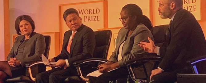 Dr James Smith (right) speaking at the Borlaug Dialogue in Iowa, October 2019 with Ms Heidi Kuhn, CEO of Roots of Peace; Hon Dr Gerardine Mukeshimana, Minister of Agriculture and Animal Resources, Rwanda; and Hon Chanthol Sun, Minister of Public Works and Transportation, Cambodia.