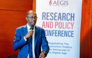 Aegis Country Director Alphonse Munyentwali speaks at Aegis research and policy conference in Kigali